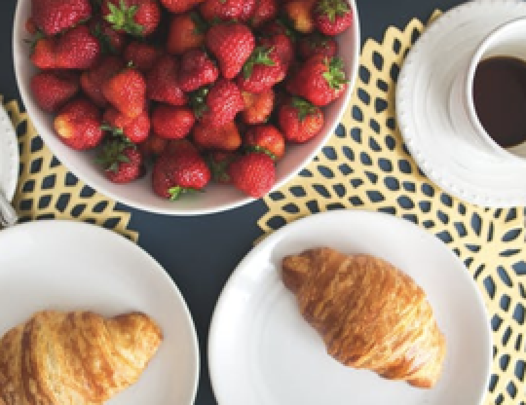 pastries and strawberries on the table.