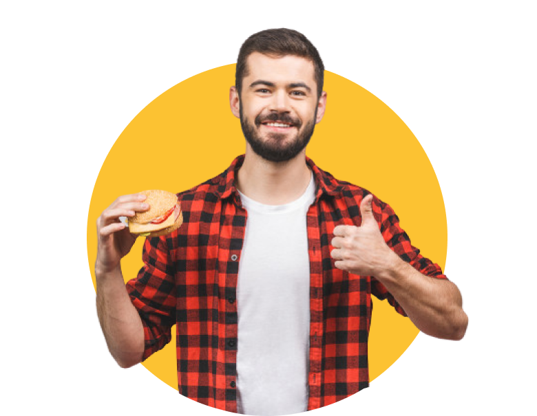 young man holding piece hamburger.